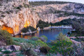 A view of Lake Vouliagmeni around sunset