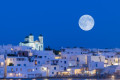 A silver moon resting over Naoussa, Paros